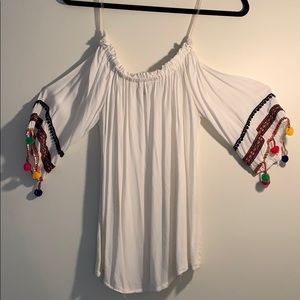 off shoulder white shirt with pom pom sleeves